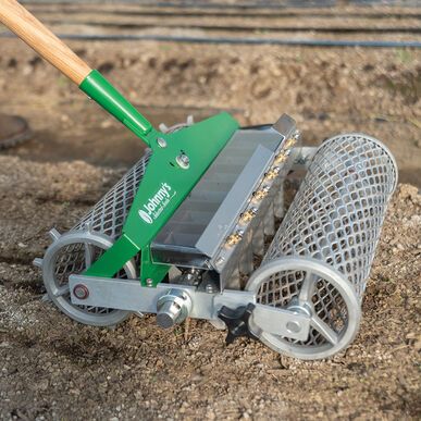 Hand seeder planting in rows